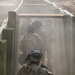 Dismounted squad moves through a trench during platoon live fire training