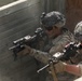 Riflemen advance through a trench during platoon live fire exercises