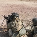 Team leader directs a squad automatic weapon to fire on an enemy target