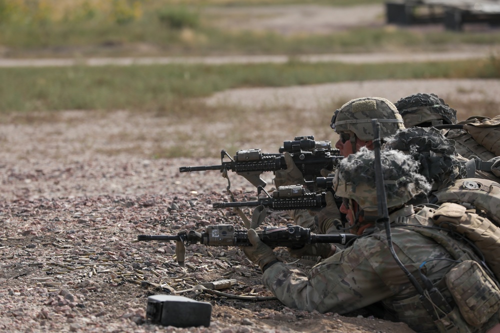 Dismounted team fires on enemy targets during platoon live fire excersizes