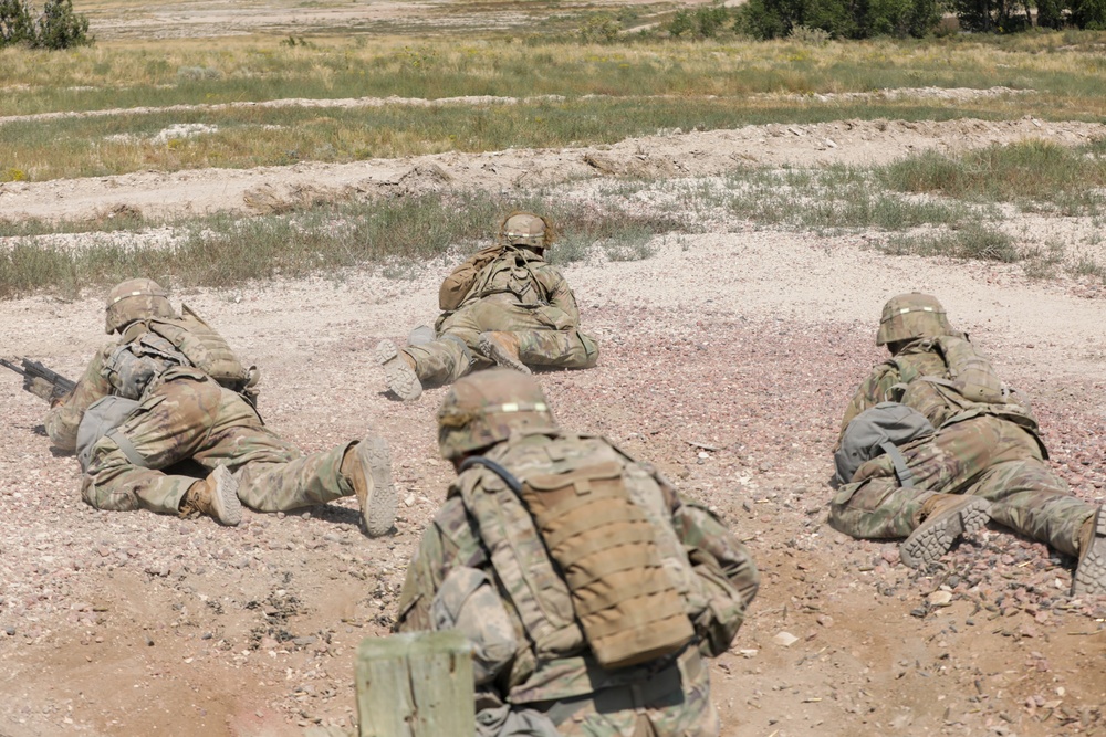 Dismounted team moves into position during platoon live fire exercises