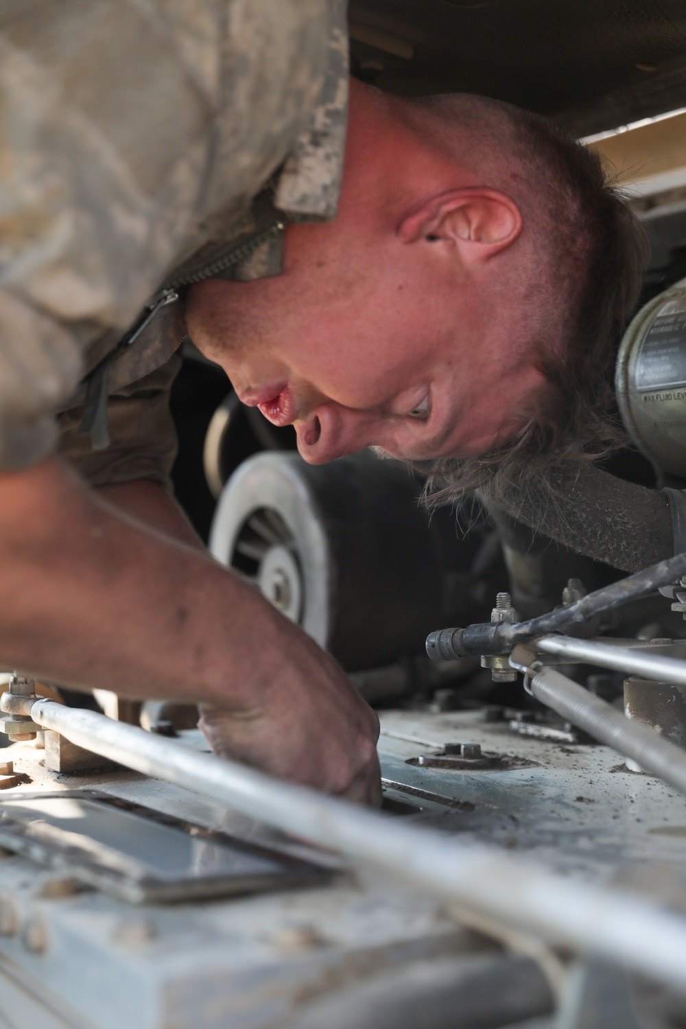 M2A3 Bradley Mechanic trouble shoots issues within the engine of a Bradley