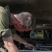 Mechanic trouble shoots issues within an M2A3 Bradley engine