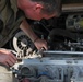 Mechanic trouble shoots issues within an M2A3 Bradley engine