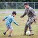 U.S. Marine Plays Soccer with an Afghan Child