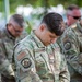 Members from the Idaho Military Division pause together to remember 9/11