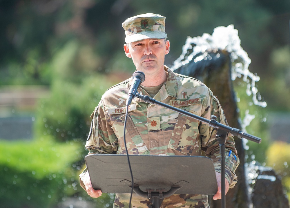 Members from the Idaho Military Division pause together to remember 9/11