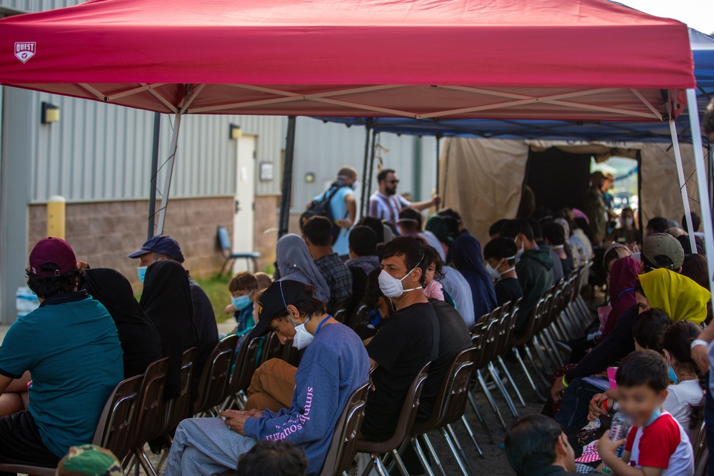 U.S. service members at Fort Pickett provide medical screening and vaccinations to Afghan civilians