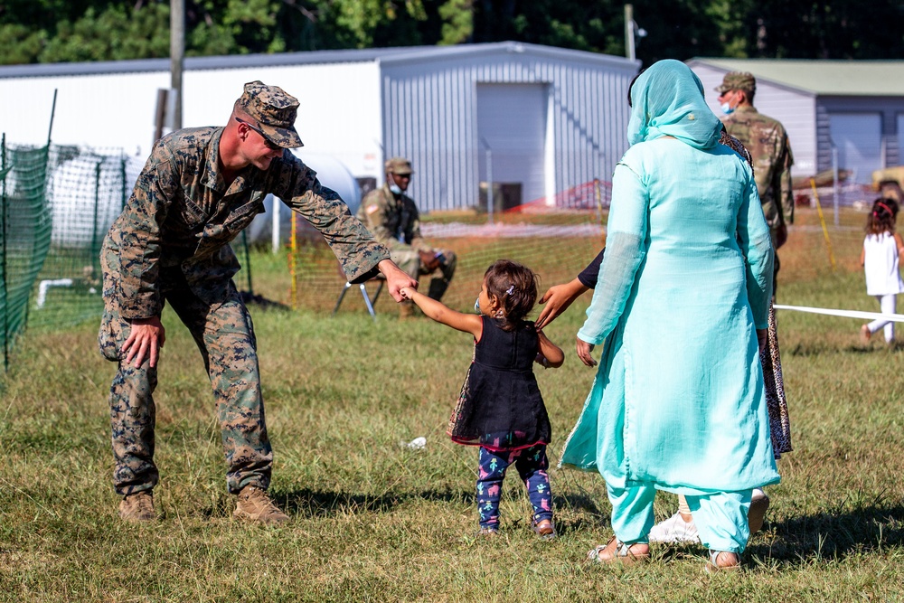 U.S. service members at Fort Pickett provide medical screening and vaccinations to Afghan civilians