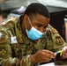 U.S. service members at Fort Pickett provide medical screening and vaccinations to Afghan civilians