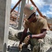 US Navy Seabees with NMCB-5 build a schoolhouse