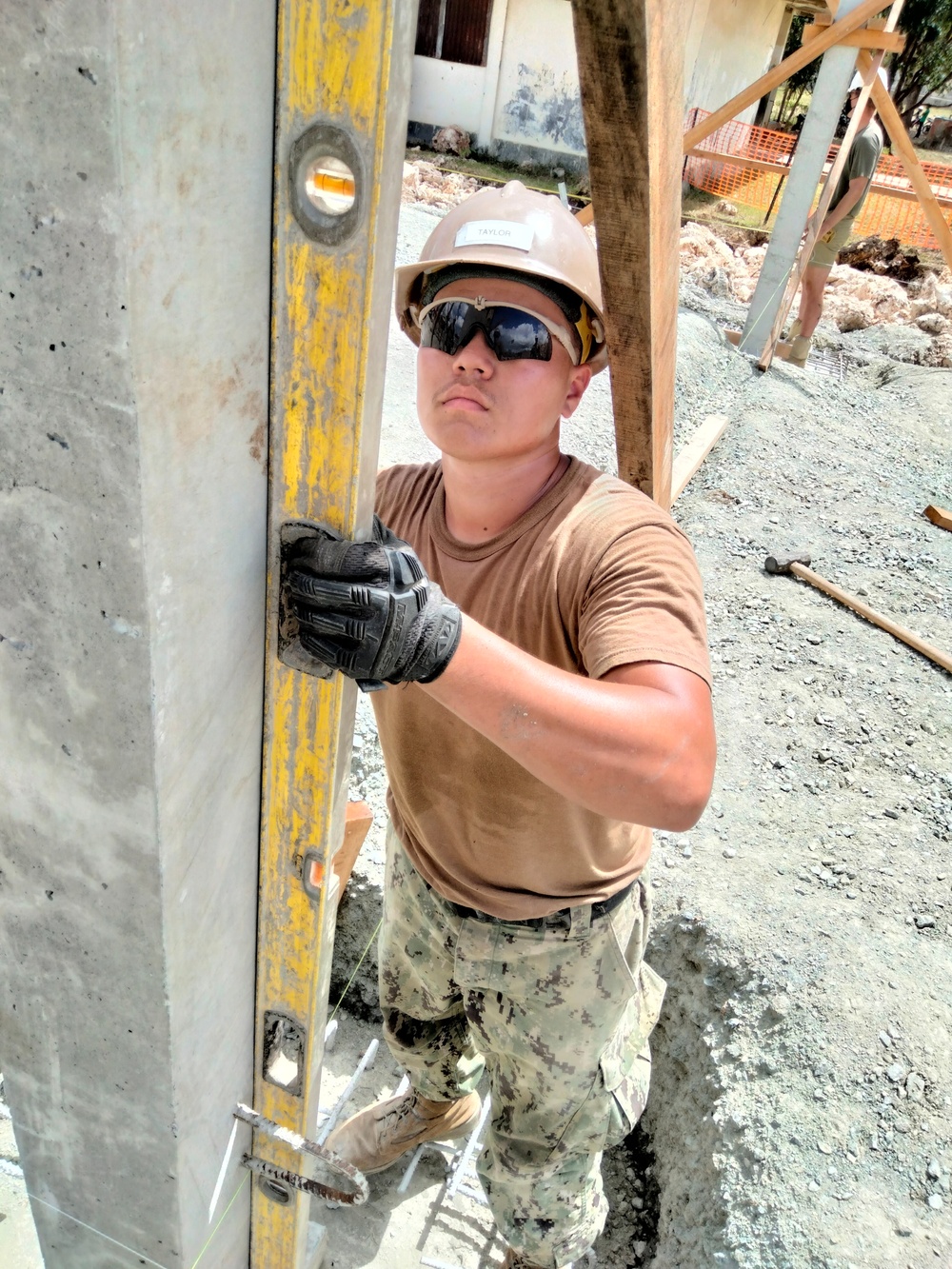 US Navy Seabees with NMCB-5 build a schoolhouse