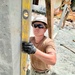 US Navy Seabees with NMCB-5 build a schoolhouse