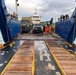 U.S. Navy Seabees assigned to NMCB-5 receive civil engineer support equipment at Papua New Guinea