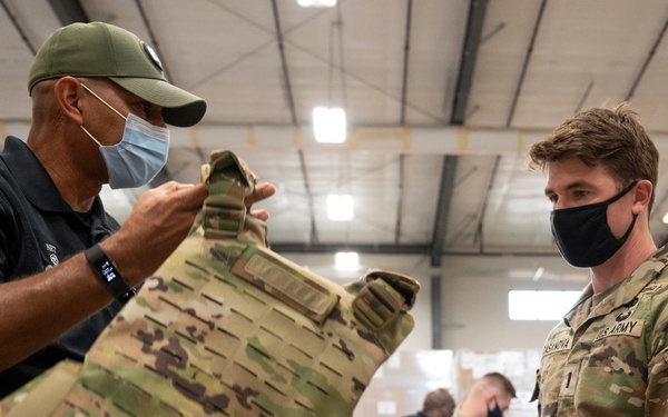 Trainer Hands Soldier MSV During Fielding