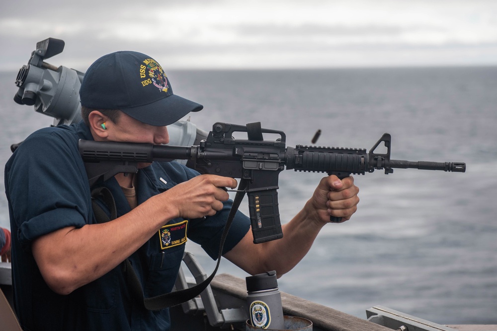 USS Mustin Sailor Fires An M4 Carbine Rifle