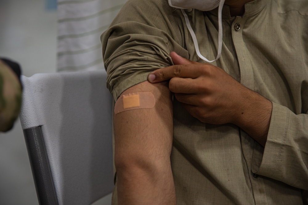 Task Force Holloman administers vaccinations to Afghan evacuees