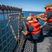 USS Billings Sailors Raise the Flight Deck Nets