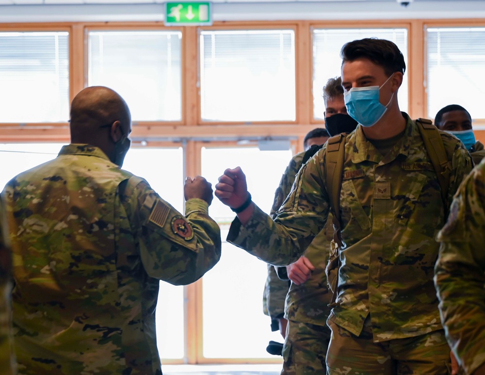 U.S. Airmen arrive at RAF Mildenhall after returning from a deployment
