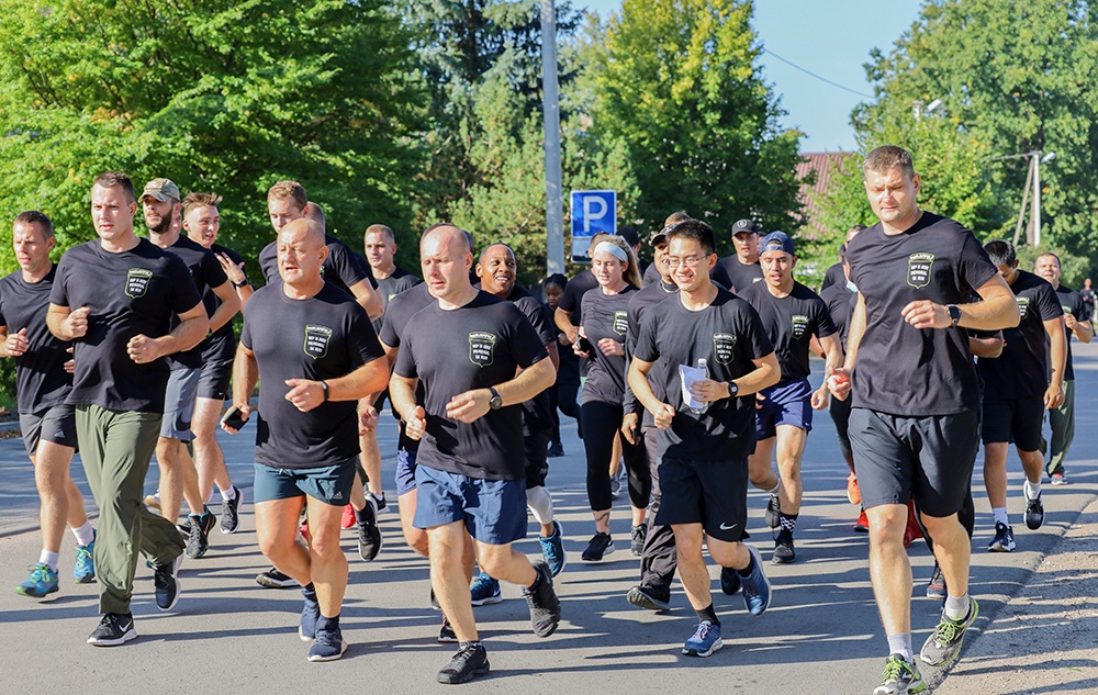 U.S. and Lithuanian Soldiers run together in remembrance of 9/11