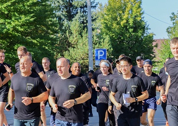 U.S. and Lithuanian Soldiers run together in remembrance of 9/11