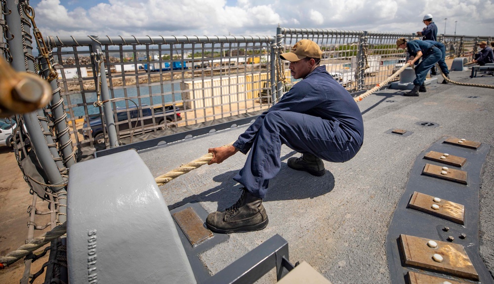 USS Billings Sailor Heaves Around a Line During Sea and Anchor Detail