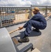 USS Billings Sailor Heaves Around a Line During Sea and Anchor Detail