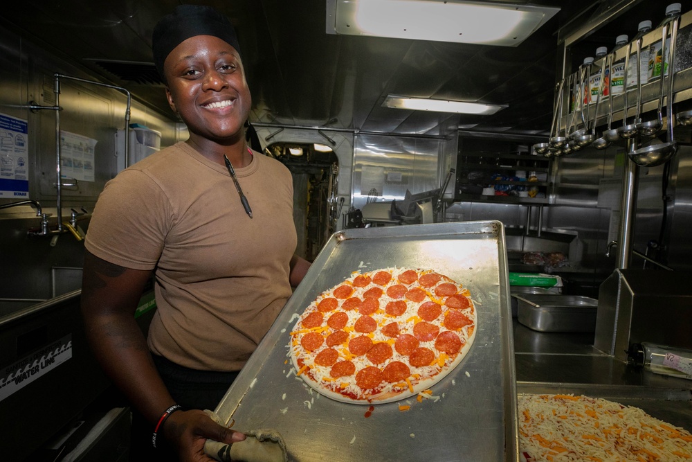 USS Sioux City Culinary Specialist Prepares a Pizza for Pizza and Wings Night