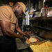 USS Sioux City Culinary Specialist Prepares a Pizza for Pizza and Wings Night