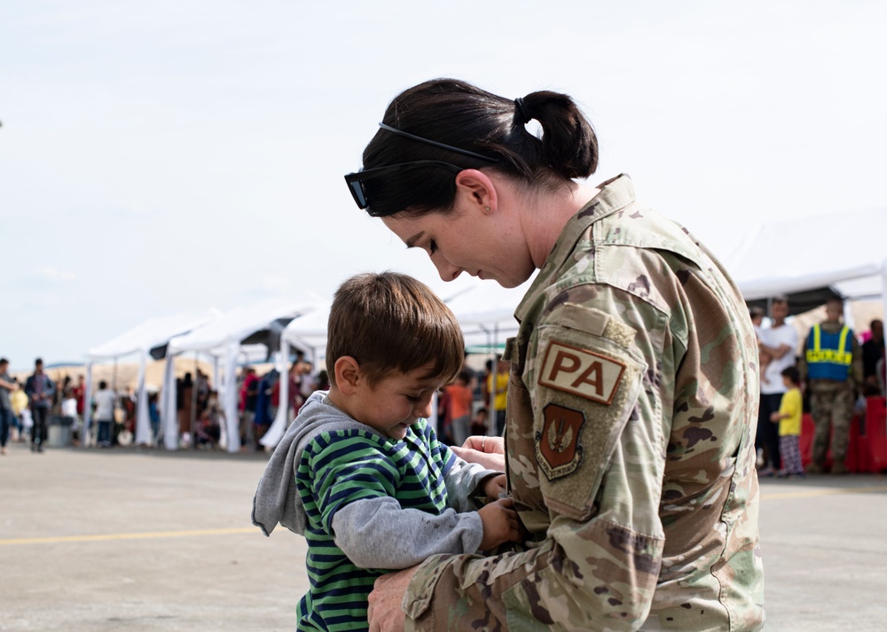 Public affairs Airmen support children during Afghan evacuation operations