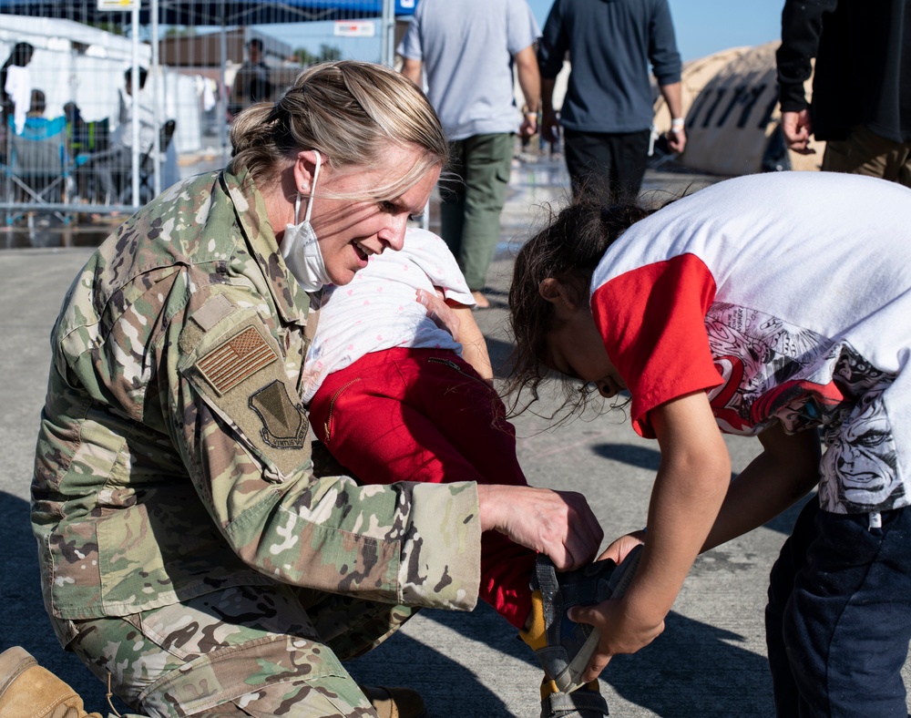 Public affairs Airmen support children during Afghan evacuation operations