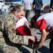 Public affairs Airmen support children during Afghan evacuation operations