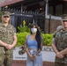 Virginia Waller-Torres, speaks with Marines from the U.S. Marine Corps Body Bearers