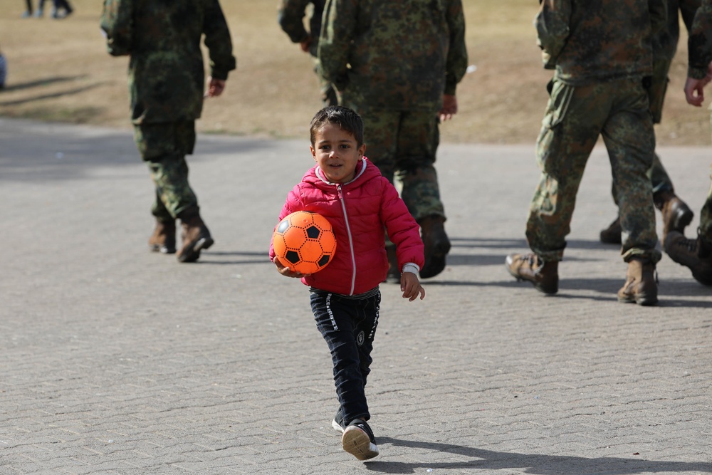 Afghan evacuees receive cold weather clothes