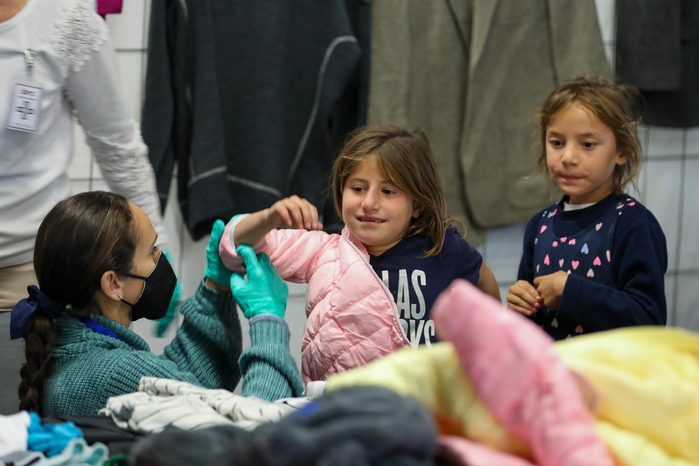 Afghan evacuees receive cold weather clothes