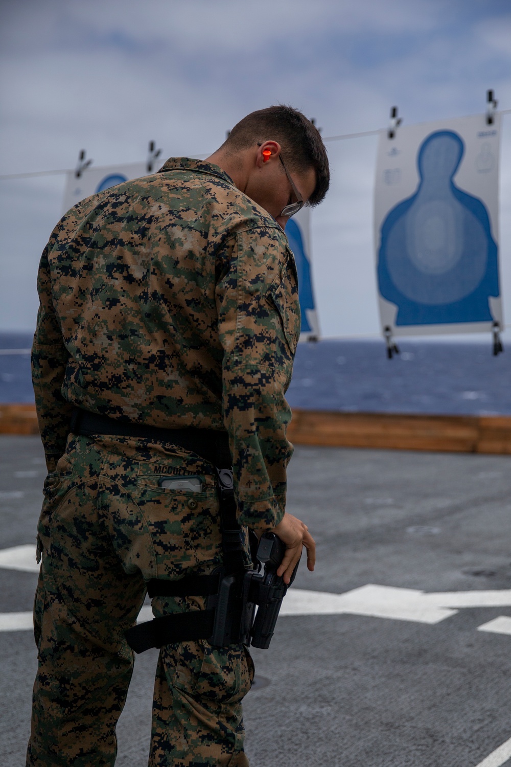 U.S. Marines and Sailors conduct M9 pistol training aboard USS John P. Murtha