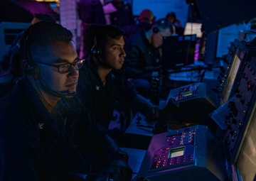 Sailors Fire Gun Weapon Systems from Combat Information Center
