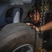 HSC 28 Sailor Inspects Landing Gear on an MH-60S Sea Hawk Helicopter