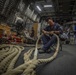 USS Billings Sailor Splices and Repairs Line