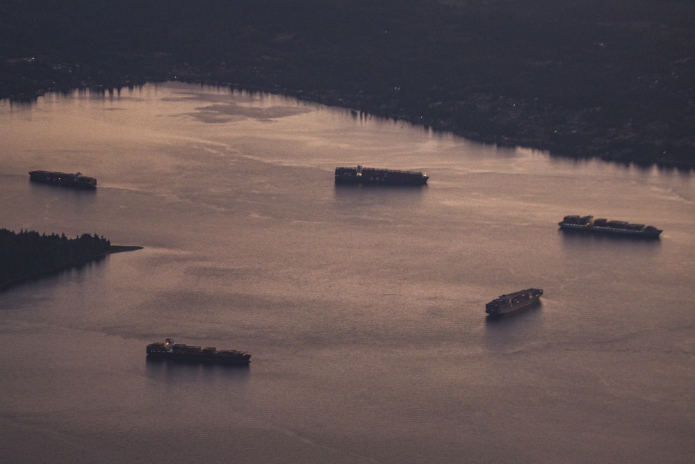 Container ships wait at a Puget Sound anchorage