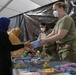 Afghan kids enjoy Books, Puzzles and toys at the new Task Force Liberty clothing distribution