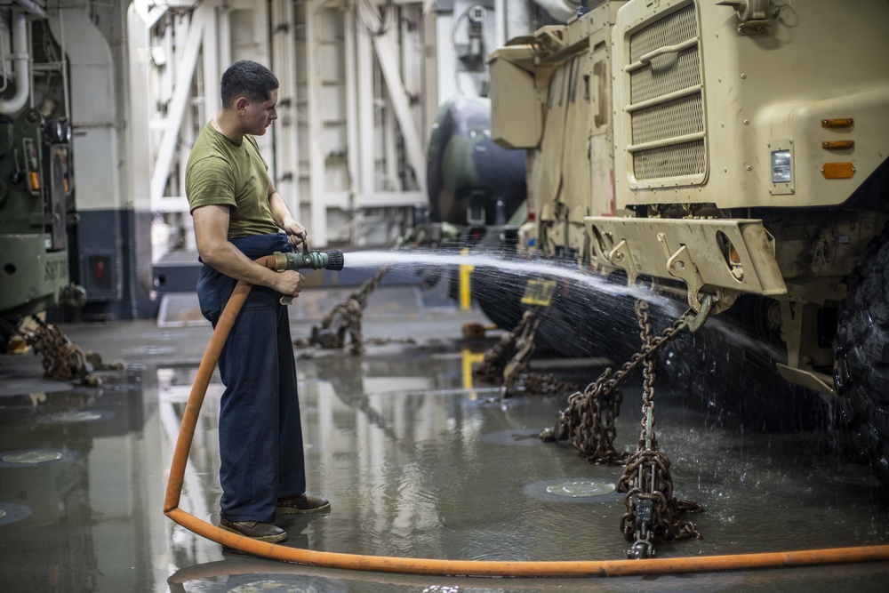 CLB-11 maintains vehicles while underway in Arabian Gulf