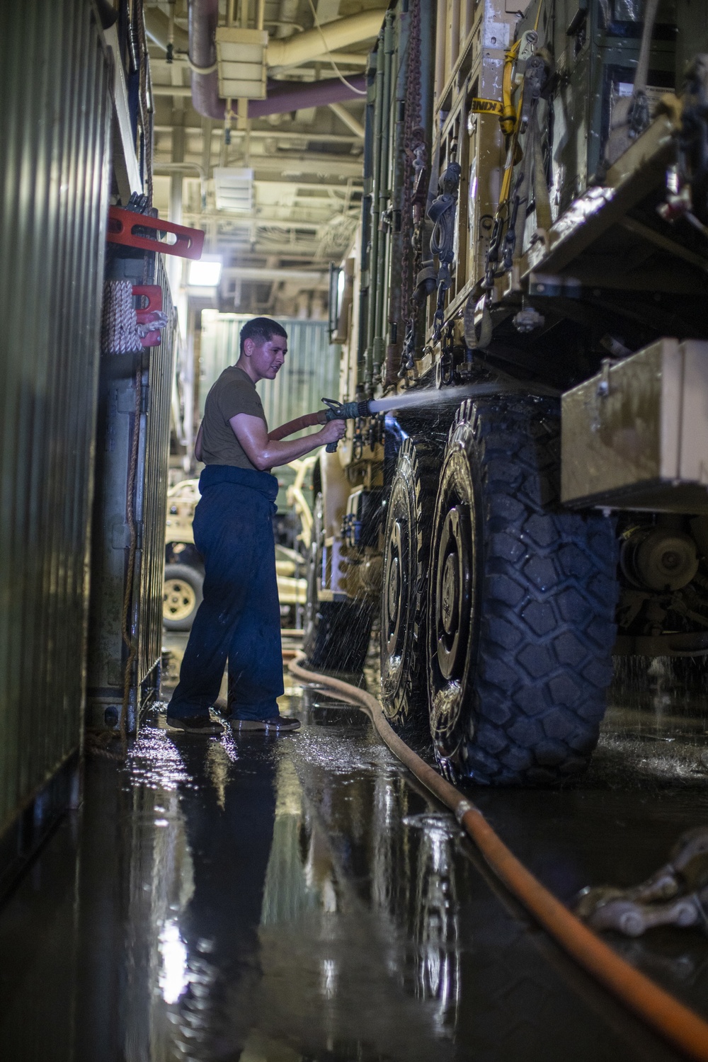 CLB-11 maintains vehicles while underway in Arabian Gulf