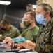 Medical personnel track medical logistics on TF Quantico