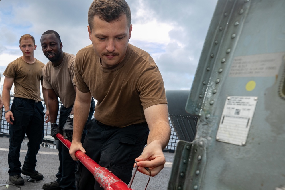 HSC 22 Sailors Prepare to Spread the Tail of a MH-60S Sea Hawk Helicopter