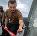 HSC 22 Sailors Prepare to Spread the Tail of a MH-60S Sea Hawk Helicopter