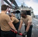 HSC 22 Sailors Prepare an MH-60S Sea Hawk Helicopter Prior to Launch