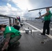 USS Sioux City Sailors Lower Flight Deck Nets Prior to Conducting Flight Ops