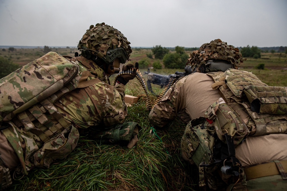 U.S. Army Dark Rifles clear trenches and provide support by fire during training exercise