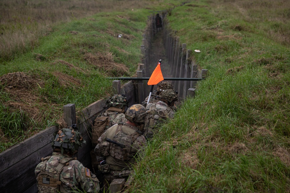 U.S. Army Dark Rifles clear trenches and provide support by fire during training exercise